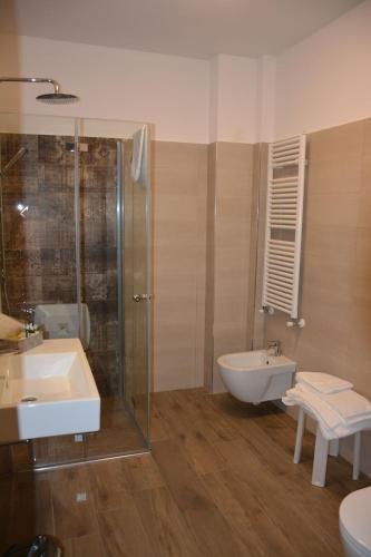 a bathroom with a shower and a sink and a tub at Asseu in Sestri Levante