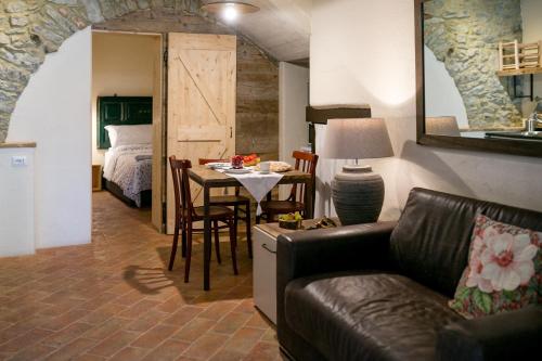 a living room with a couch and a table at Casa Zeni in Cortona
