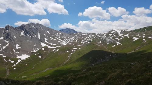 a view of a mountain range with snow at Apart-Garni Motnaida in Samnaun