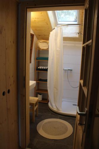 a small room with a window in a tiny house at Spring-Hof in Oberostendorf