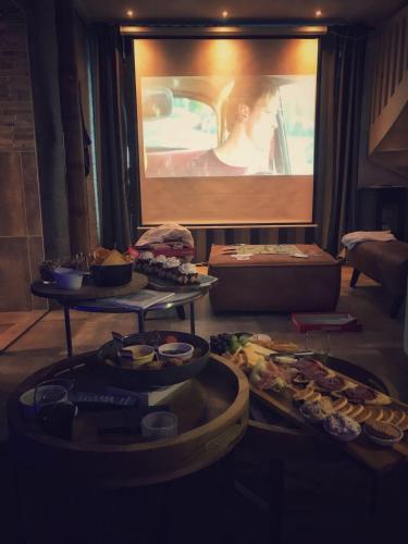 a table with several trays of food in a room at Byonz in Groningen