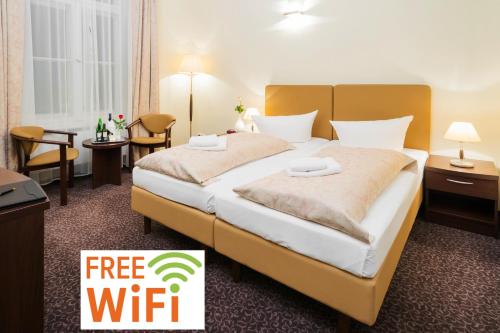 Кровать или кровати в номере Upper Room Hotel Kurfürstendamm