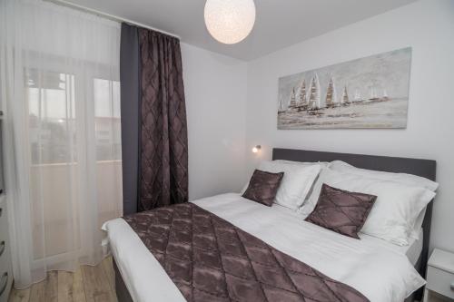 Postel nebo postele na pokoji v ubytování Villa Apartments Katja