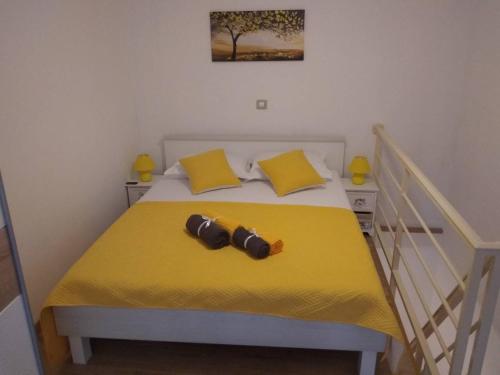 Postel nebo postele na pokoji v ubytování Apartman Laura