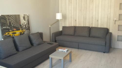 A seating area at Apartment Rajska