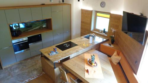 a kitchen with a counter and a sink in it at Gasthaus Dorfberg in Kartitsch