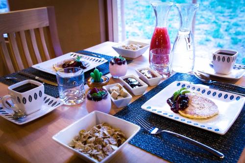 a table with plates of food on top of it at Naturalis Hotel in San Pedro de Atacama