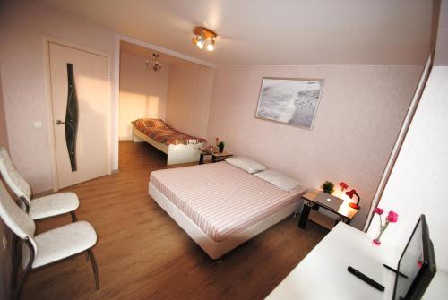  Кровать или кровати в номере Business Apartment Vologda Center 