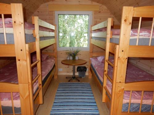 a room with four bunk beds in a cabin at Kalda Camping Valma in Valma