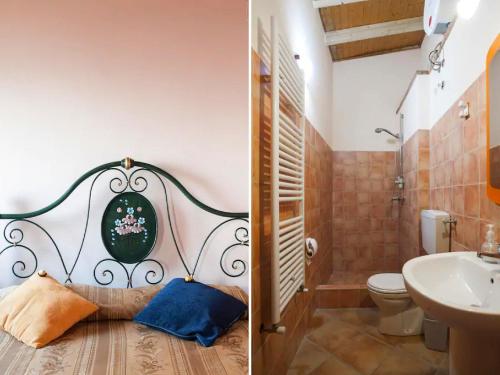 a bathroom with a toilet and a sink at Vasari in Santa Lucia del Mela