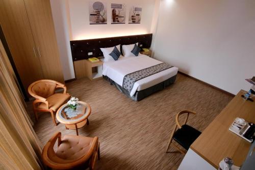 Postel nebo postele na pokoji v ubytování Botahtaung Hotel