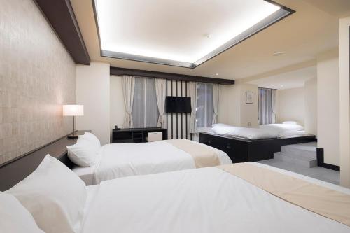 Ένα ή περισσότερα κρεβάτια σε δωμάτιο στο EN HOTEL Fujisawa