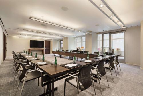 a conference room with a long table and chairs at Hyatt Centric Times Square New York in New York