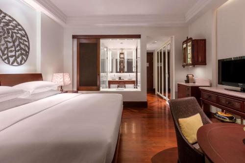 Ένα ή περισσότερα κρεβάτια σε δωμάτιο στο Park Hyatt Siem Reap