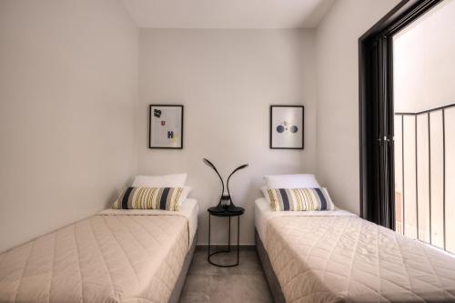 Ένα ή περισσότερα κρεβάτια σε δωμάτιο στο Yohanan HaSandlar