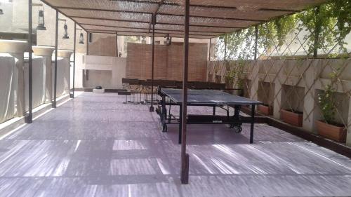 a ping pong table in the middle of a patio at XVA Art Hotel in Dubai