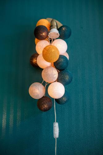 a group of different colored lights on a table at Hôtel Central in Pau