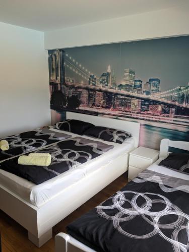 two beds sitting next to each other in a bedroom at Sarajevo Apartment Ilidza in Sarajevo