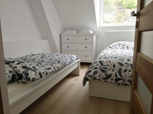 Un pat sau paturi într-o cameră la Winzerhaus Loreley