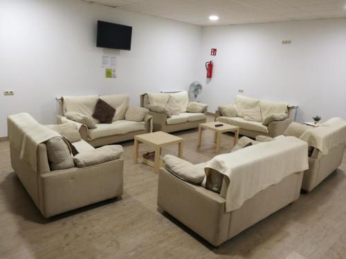 A seating area at Albergue O Trisquel