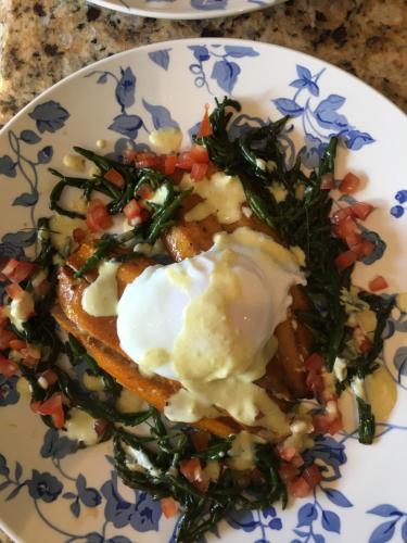 a plate of food with an egg on top at The Garden Room at Sleepy Hollow in Louisburgh