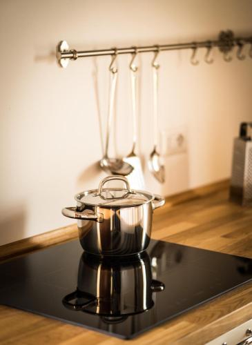 a pot on top of a stove in a kitchen at Agriturismo Rosa Antica in Monte San Vito