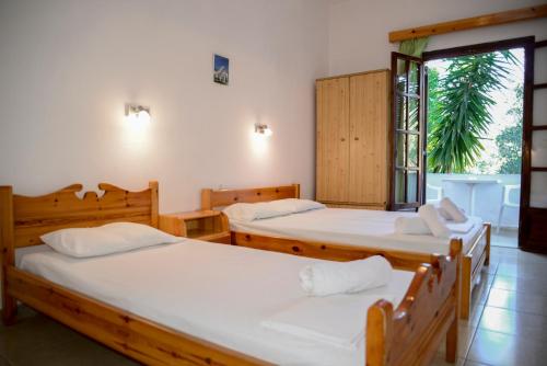 Ένα ή περισσότερα κρεβάτια σε δωμάτιο στο Corfu Room