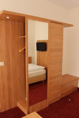 Ένα ή περισσότερα κρεβάτια σε δωμάτιο στο Ringhotel Haus Oberwinter