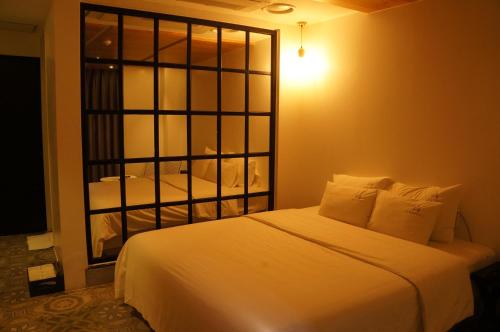 Postel nebo postele na pokoji v ubytování SOYU Hotel