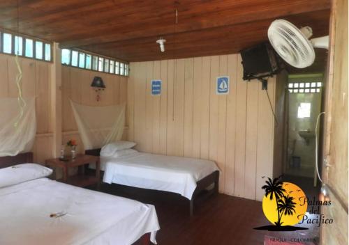 Postel nebo postele na pokoji v ubytování Hotel Palmas del Pacifico