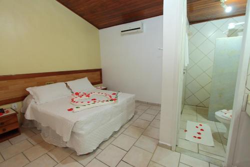 Ένα ή περισσότερα κρεβάτια σε δωμάτιο στο Navegantes Hotel