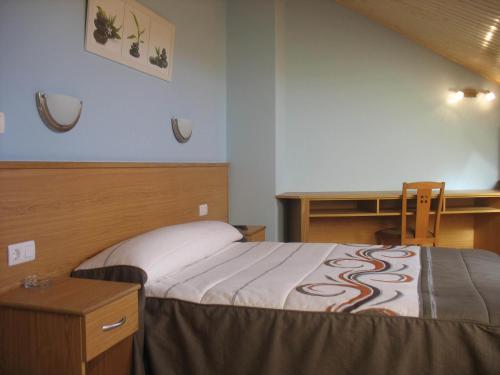 Postel nebo postele na pokoji v ubytování Hotel Reyes De León