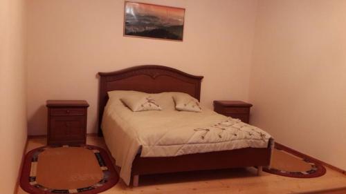 Postel nebo postele na pokoji v ubytování Садиба у Вишкові
