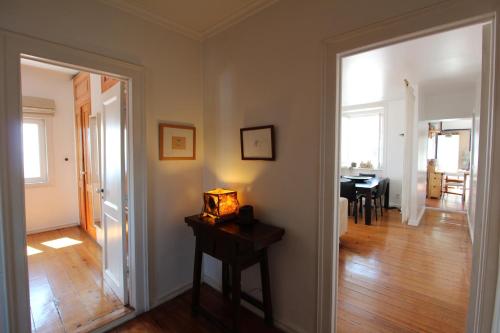 a living room with a table and a dining room at Estrela Penthouse - Amazing Views in Lisbon