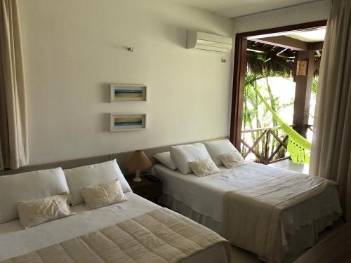 Eco Flecheiras Residence tesisinde bir odada yatak veya yataklar