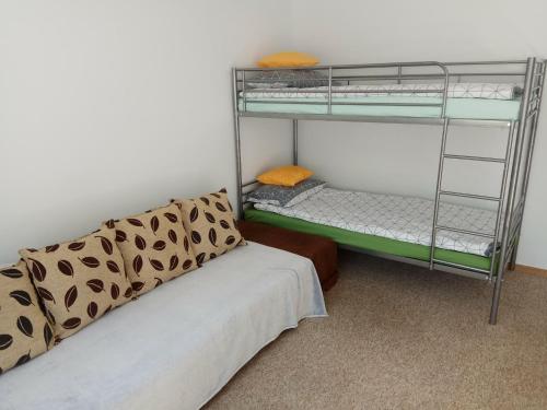 a room with two bunk beds and a bed at pokój blisko morza in Kołobrzeg