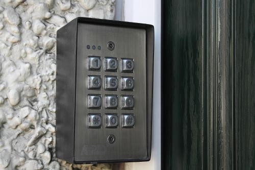 a remote control is attached to a stone wall at The Railway Sleeper Lodge in Colchester