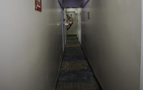 a hallway with a long aisle with a long corridorngthngthngthngthngthngth at Saint Lawrence Residences and Suites in Toronto