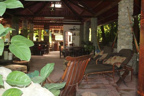 a group of chairs and tables in a restaurant at Los Aramos in Valle de Anton