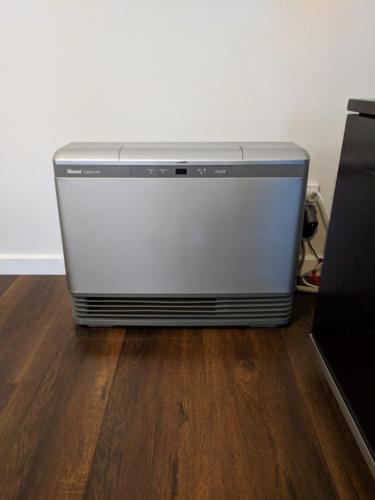 a refrigerator sitting on the floor in a room at Blue on McNab in Katoomba