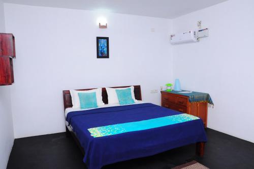 Ένα ή περισσότερα κρεβάτια σε δωμάτιο στο Villa Anna Pondy