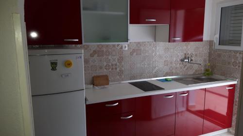 Kuchyň nebo kuchyňský kout v ubytování Apartments Babić