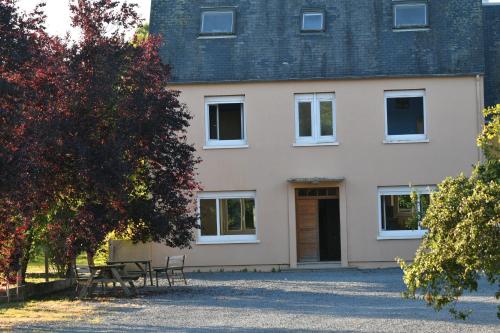 a house in the middle of a park at Gîtes de la terrette in Tribehou