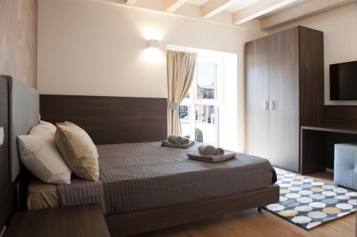 En eller flere senger på et rom på Canaletto Luxury Home