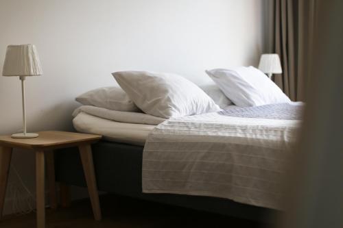 Un pat sau paturi într-o cameră la Sopot Apartamenty Bema 6