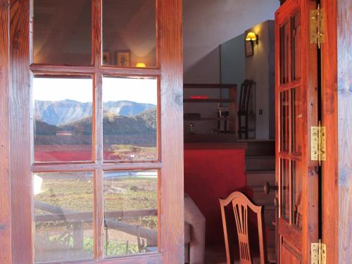 a door to a room with a view of a mountain at Haciendas del Valle - Las Kentias in Valle de Guerra