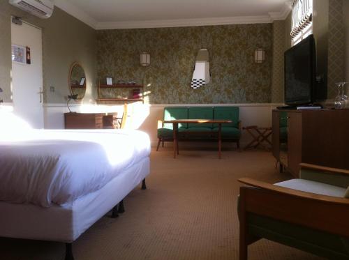 מיטה או מיטות בחדר ב-Hotel Ermitage