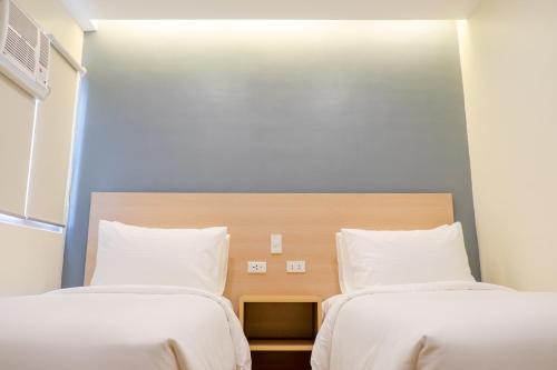 Postel nebo postele na pokoji v ubytování Bridge Hotel