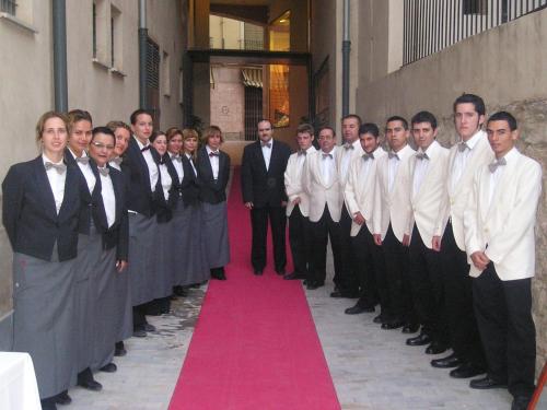 a group of men in suits standing on a red carpet at Sercotel Palacio de Tudemir in Orihuela