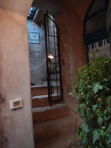 an entrance to a building with a sign on a window at Ca' de Pria in Borgio Verezzi